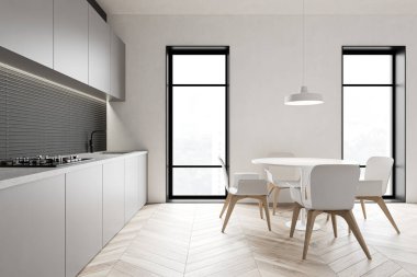 Yuvarlak masalı gri mutfak.