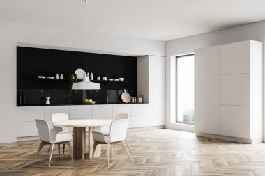 Dolabı ve masası olan beyaz mutfak köşesi.