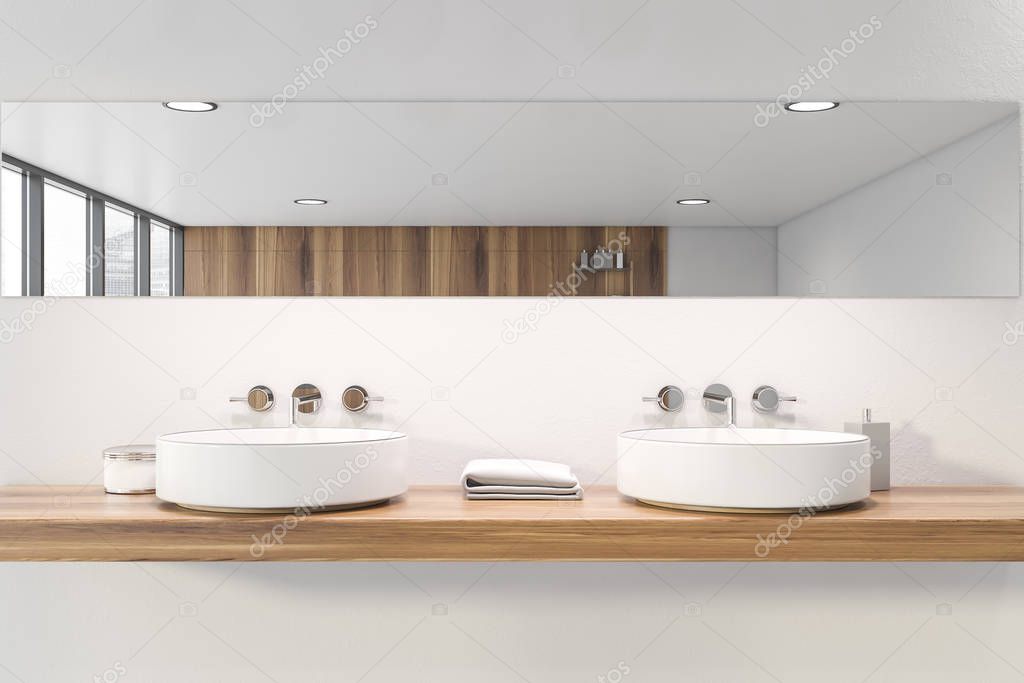 Double sink in white bathroom