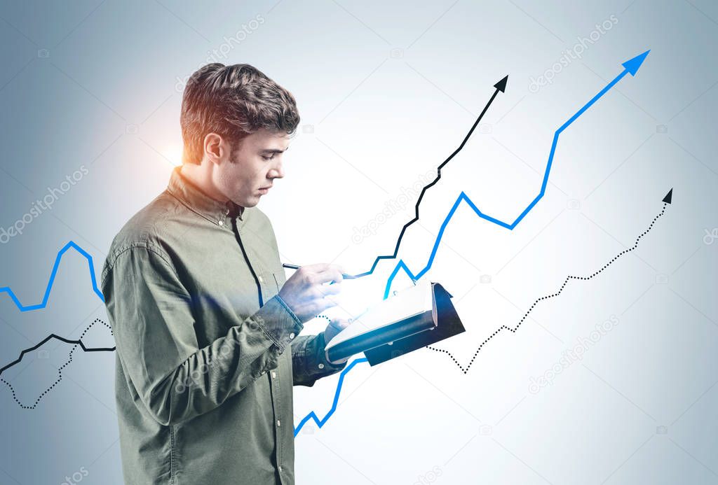 Man with notebook and growing graph