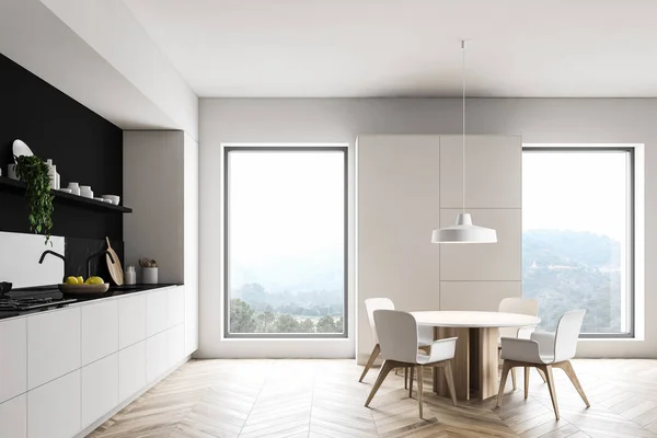 Intérieur de cuisine blanche avec placard et table — Photo