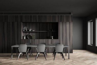 Koyu ahşap mutfak ve yemek masası.