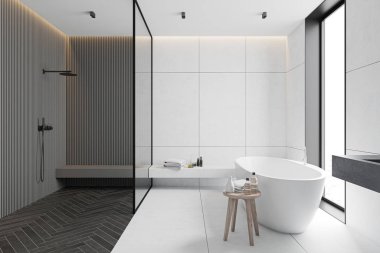 Gri ve beyaz banyo içi, küvet ve duş.