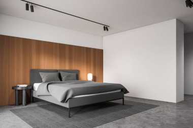 Minimalist beyaz ve ahşap yatak odası köşesi