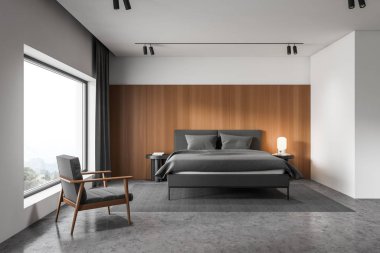 Beyaz ve ahşap yatak odasının içi koltukla dolu.