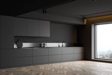 Tezgahlı, minimalist gri mutfak köşesi.