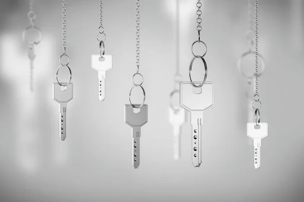 Srebrne klucze na łańcuchach, koncepcja nieruchomości — Zdjęcie stockowe
