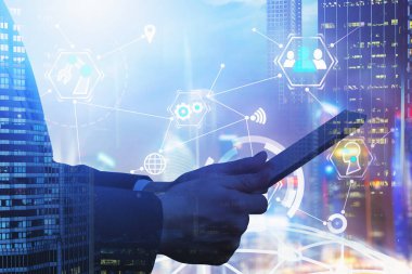 Man with tablet and business interface