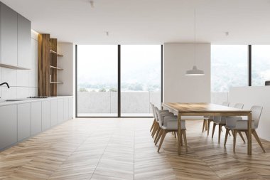 Beyaz mutfak, balkon ve masa.