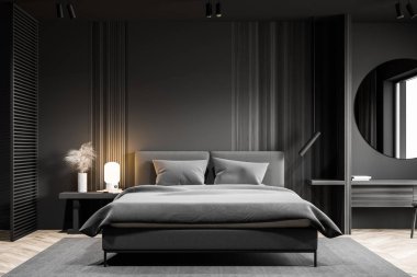 Yuvarlak aynalı gri yatak odası.