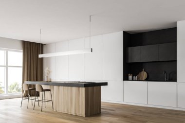 Tezgahı ve çubuğu olan beyaz mutfak köşesi.