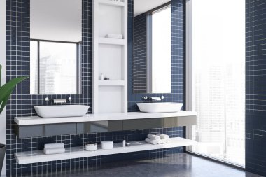 Çift lavabolu mavi fayanslı banyo köşesi