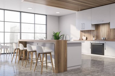 Bar ve masa ile beyaz ve ahşap mutfak köşesi