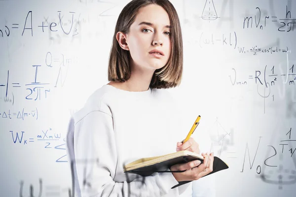 Teen girl with notebook and formula, education — 스톡 사진