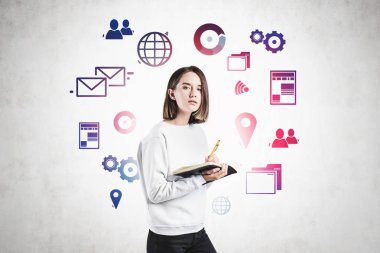 Not defteri ve internet simgeleri olan genç bir öğrenci