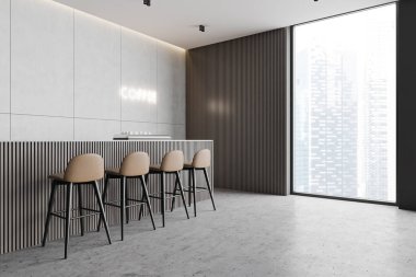 Bar tezgahı olan minimalist bir kafeterya.