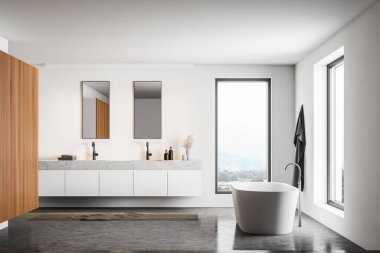 Dolabı olan beyaz ve ahşap bir banyo.