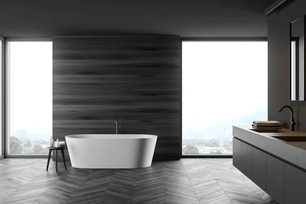 Szara i drewniana łazienka z wanną i umywalką — Zdjęcie stockowe