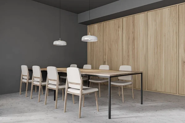 Long table in gray and wooden cafe corner