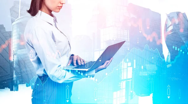 Woman using laptop in city, digital chart — Stock Photo, Image