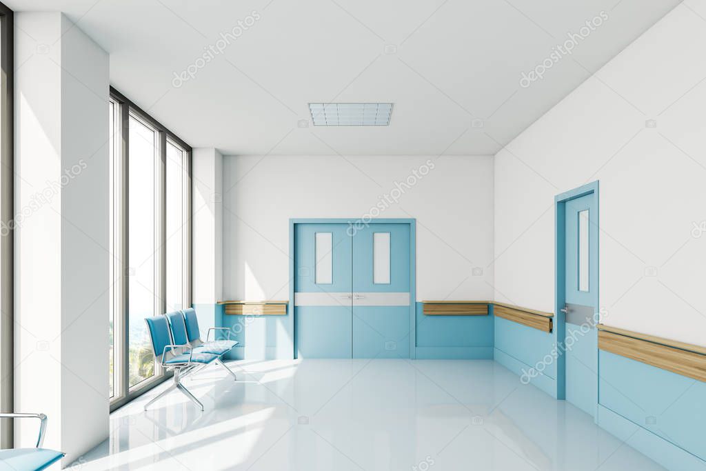 Empty hospital corridor with chairs