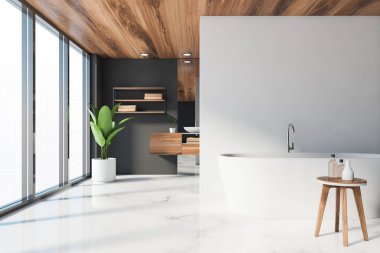 Lüks banyo, beyaz ve gri duvarlar, mermer zemin, ön planda rahat beyaz küvet ve ahşap tezgahın üzerinde duran yuvarlak lavabo. Panoramik pencere. 3d oluşturma
