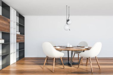 Beyaz duvarları, ahşap zemini, beyaz sandalyeli yuvarlak masası ve bulaşıklı dolabı olan modern yemek odasının içi. 3d oluşturma