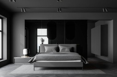 Geniş yatak odasının ön manzarası gri duvarlar, koyu ahşap zemin, lambalı rahat komodin, arka planda büyük boy yatak ve banyo. 3d oluşturma