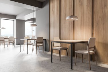 Gri ve ahşap duvarları, beton zemini, uzun ahşap ve kare tabloları ve tabureli bar tezgahı olan modern endüstriyel bar köşesi. 3d oluşturma