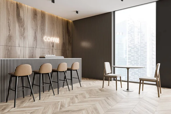 Corner of minimalistic coffee shop with wooden and grey walls, wooden floor, bar counter with brown stools and glowing coffee sign and round table with chairs. 3d rendering