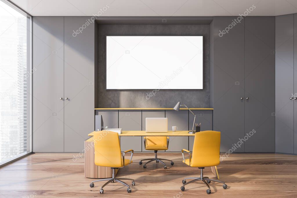 Interior of stylish boss office with grey walls, wooden floor, yellow table with chairs, wardrobes and horizontal mock up poster frame. 3d rendering