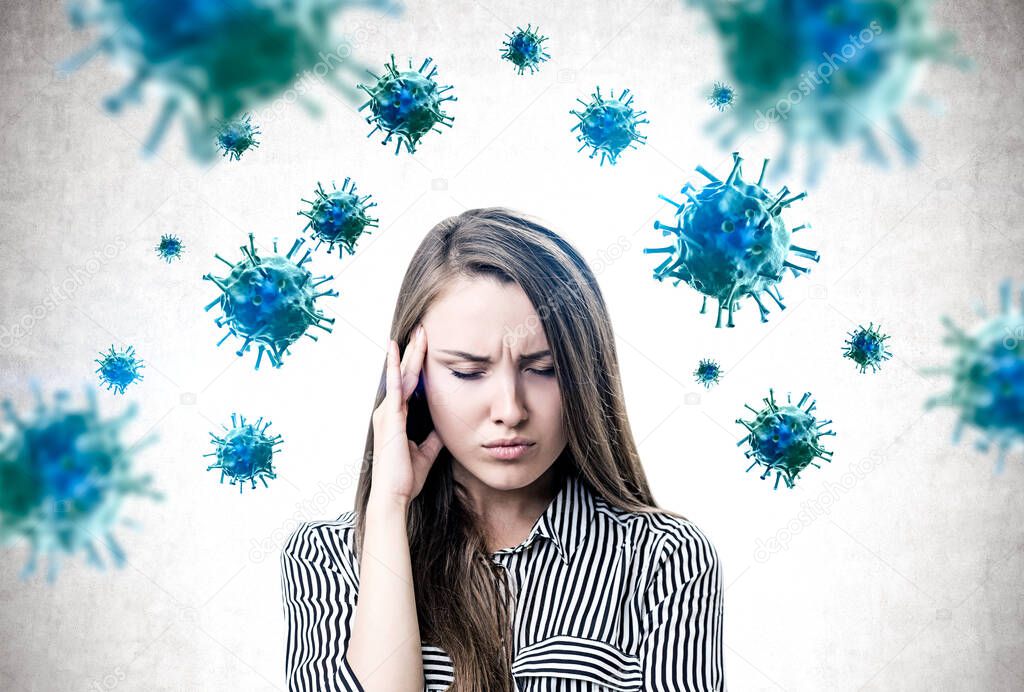 Beautiful young woman with headache standing near concrete wall with blurry blue viruses around her. Concept of Asian flu coronavirus and respiratory disease