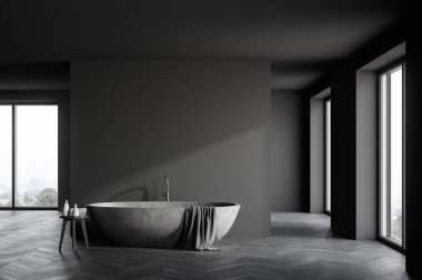 Geniş, lüks bir banyo. Gri duvarları, koyu ahşap zemini, rahat taş küveti, havluları ve güzellik ürünleri olan sandalyeleri var. 3d oluşturma