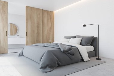 Minimalist yatak odasının köşesinde beyaz duvarlar, beton zemin, rahat kral yatağı gri battaniye ve lavabo ve arka planda yuvarlak ayna. Tahta sürgülü kapı. 3d oluşturma