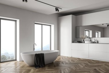 Beyaz duvarları, ahşap zemini, büyük aynası ve bulanık dağ manzaralı pencereler arasında duran rahat beyaz küvetin köşesi. 3d oluşturma