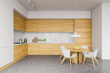 Modern mutfak içinde beyaz sandalyeli yuvarlak yemek masası beyaz fayanslı duvarlar, beton zemin ve ahşap dolaplar ve tezgahlar. 3d oluşturma