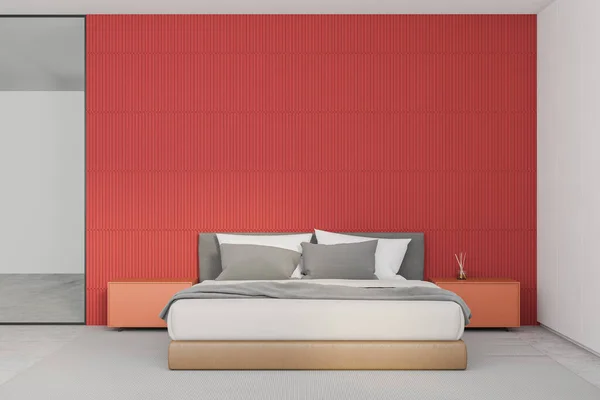 Interior of minimalistic master bedroom with red and white walls, concrete floor, comfortable king size bed and orange bedside tables. 3d rendering