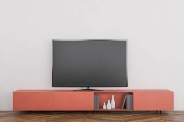 Beyaz duvarları ve ahşap zemini olan şık oturma odasında, turuncu dolabın üzerinde duran modern düz ekran televizyon. Eğlence anlayışı. 3d oluşturma