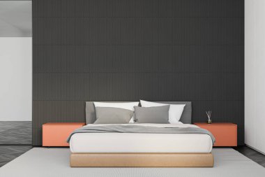 Gri beyaz duvarları, koyu ahşap zemini, rahat kral yatağı ve turuncu komodinli minimalist yatak odasının içi. 3d oluşturma