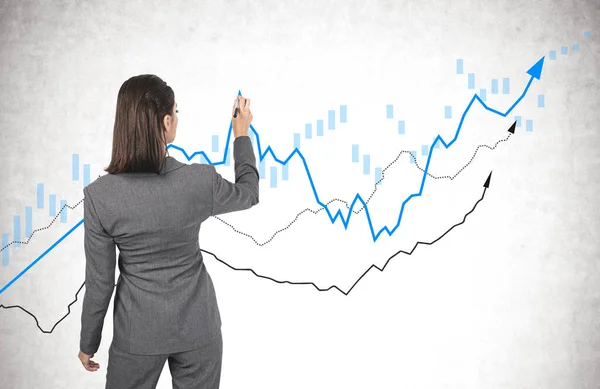 Rear View Businesswoman Dark Hair Drawing Rising Graphs Concrete Wall — Stock Photo, Image