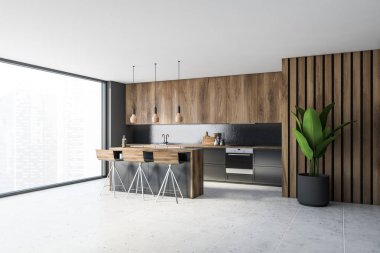 Gri ve ahşap duvarları olan şık bir mutfağın köşesi fayansla döşenmiş zemin, üzerinde ahşap dolaplar olan gri tezgah ve tabureli rahat bir bar tezgahı. 3d oluşturma