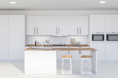 Modern mutfakta beyaz duvarları ve zemini, tezgahları ve dolapları ve fırınlarda yapılmış iki taburesi olan rahat bir bar. 3d oluşturma