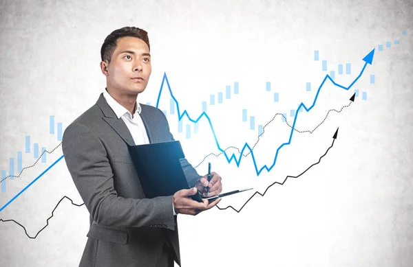 Thoughtful Asian Businessman Making Notes Clipboard Standing Concrete Wall Growing — Stock Photo, Image