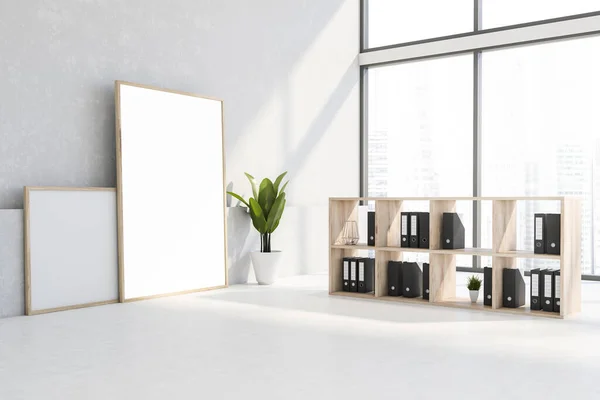 Interior of panoramic loft office with white walls and floor, wooden bookcase with folders and vertical mock up poster standing on the floor. 3d rendering