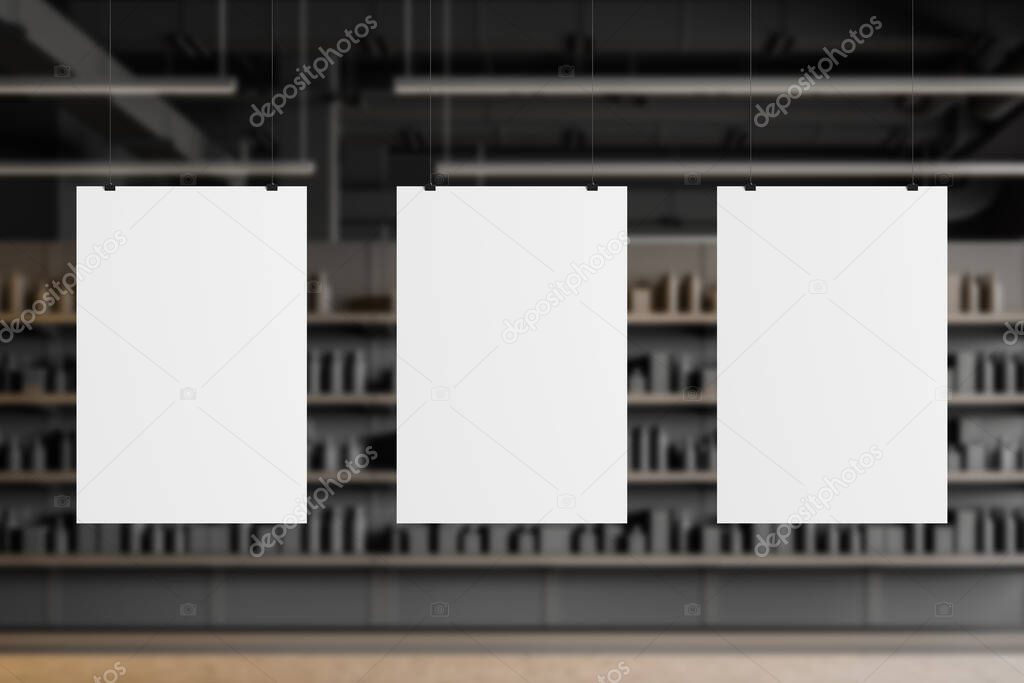 Three vertical mock up posters hanging in blurry supermarket or warehouse with grey walls and concrete floor. Concept of advertising and sale. 3d rendering