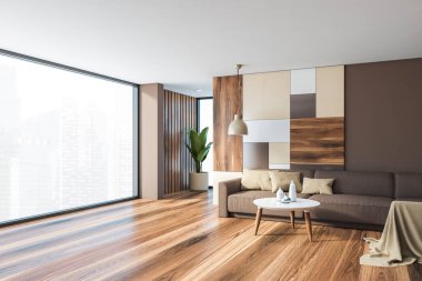 Parlak panoramik oturma odasının köşesinde kahverengi ve renkli desenli duvarlar, ahşap zemin, rahat kahverengi kanepe ve yuvarlak kahve masası. Bulanık şehir manzaralı bir pencere. 3d oluşturma