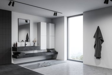 Beyaz ve gri fayanslı duvarları olan çatı katı otel banyosunun köşesi beton zemin ve dikey aynalı büyük bir lavabo kırsal manzaralı büyük bir pencerenin yanında duruyor. 3d oluşturma