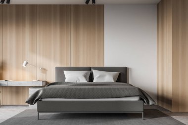 Minimalist büyük yatak odasının içinde beyaz ve ahşap duvarlar, beton zemin, rahat yatak ve masa ile ofis köşesi. 3d oluşturma