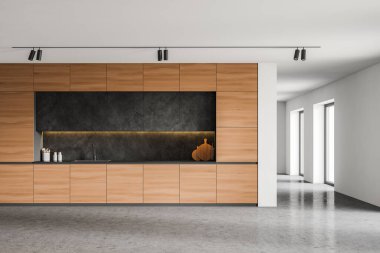 Beyaz duvarları, beton zemini, tencere, lavabo ve koyu gri dolapları olan geniş bir çatı katı mutfağı. 3d oluşturma