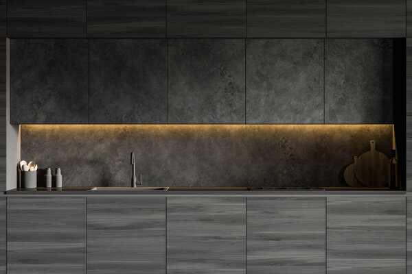 Close up of dark wooden countertops with built in sink and cooker standing in stylish kitchen with gray cupboards and walls. 3d rendering